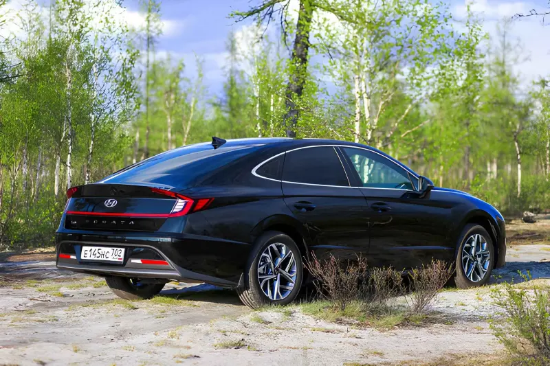 2020 Hyundai Sonata Hybrid sedan in dark blue, parked on a residential street