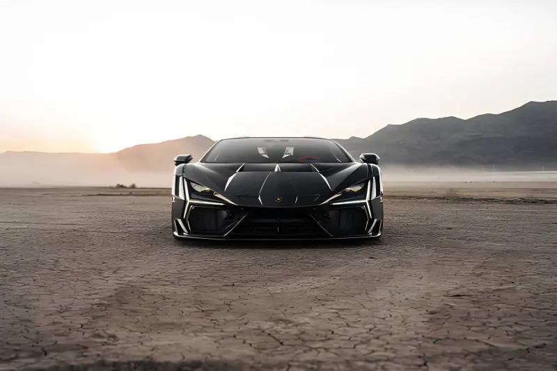 Lamborghini Revuelto plug-in hybrid supercar, rear three-quarter view showing aerodynamic design and active rear wing